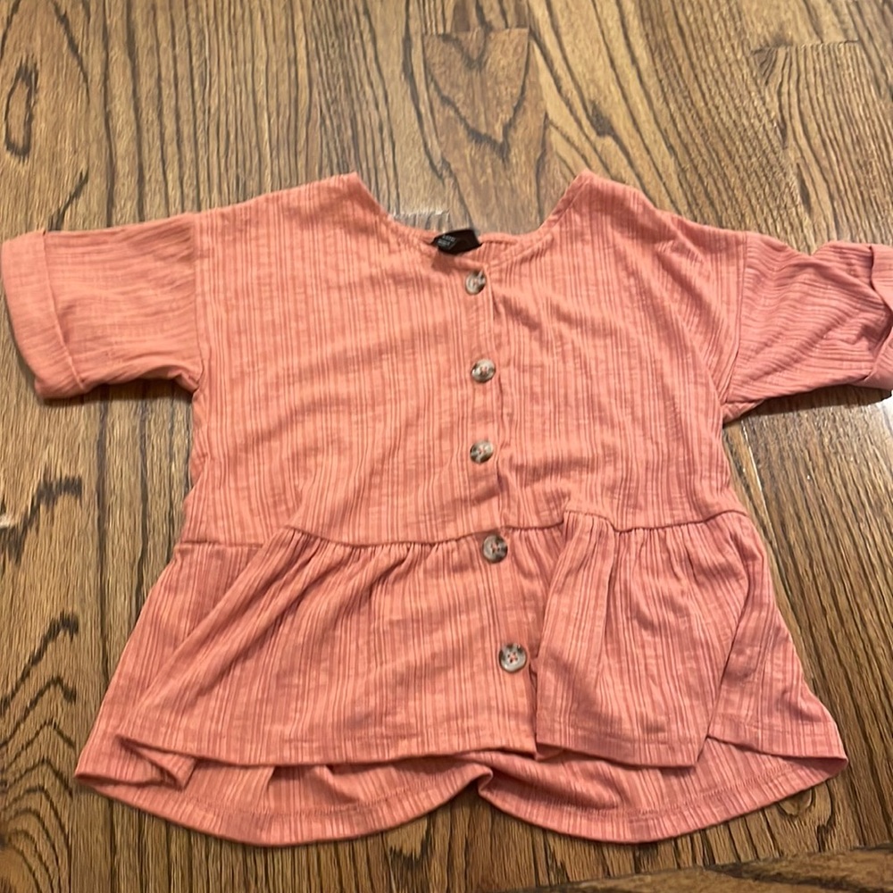 Target brand shirt with cute buttons going down it.